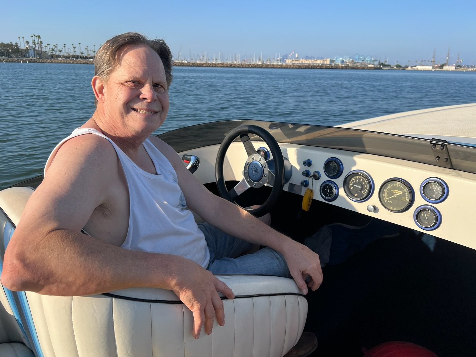 Richard at the wheel of his boat